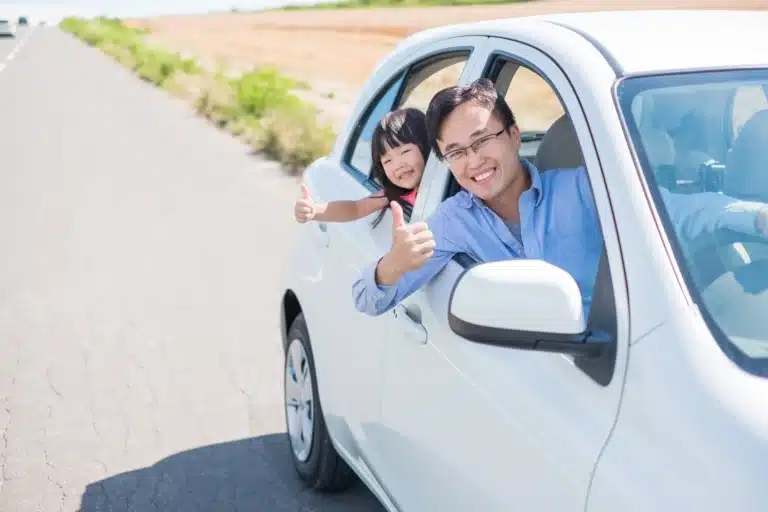 Father and child with electric car leasing - Velocity Leasing