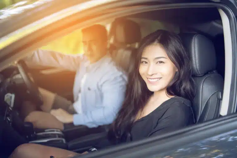 Happy couple with monthly electric car leasing - Velocity Leasing