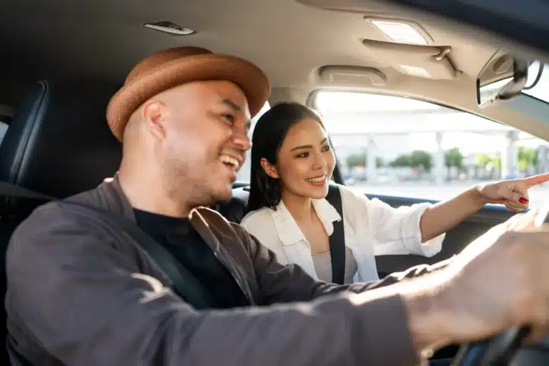 Smiling couple with long-term electric car leasing - Velocity Leasing